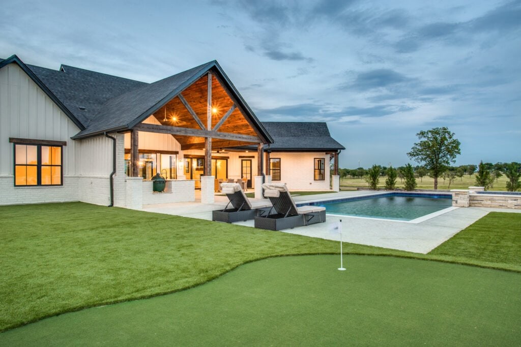 Rear terrace, timber porch, and pool at Modern Ranch