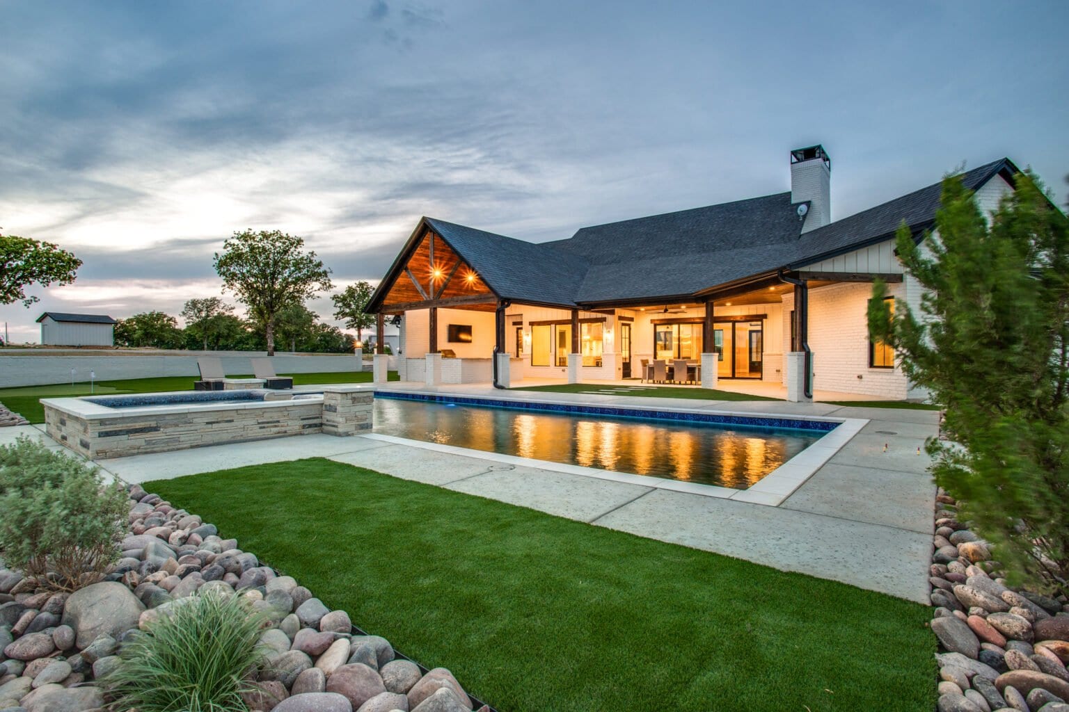 Modern Ranch exterior and pool at dusk