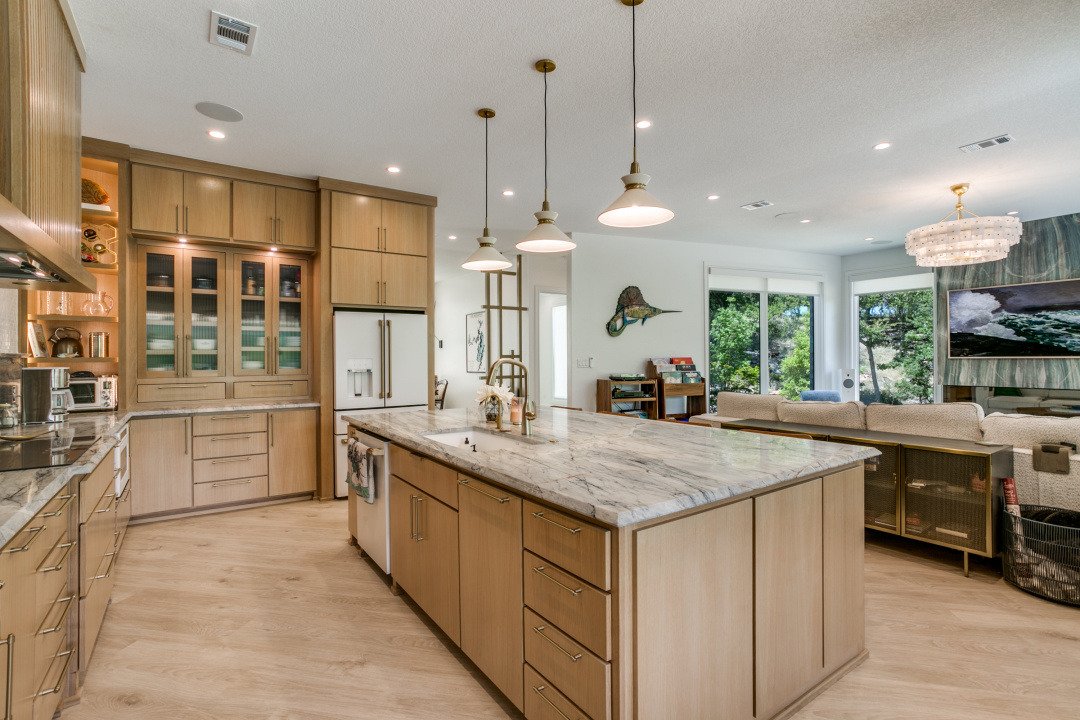 Warm wood cabinetry and stone in an Edge Crew kitchen