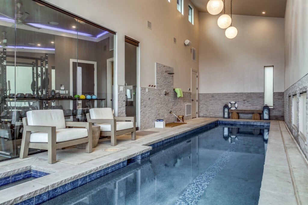 Indoor swimming pool and lounge seating at El Regalo