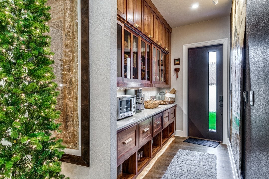 Walk-in pantry with wood cabinetry at El Regalo